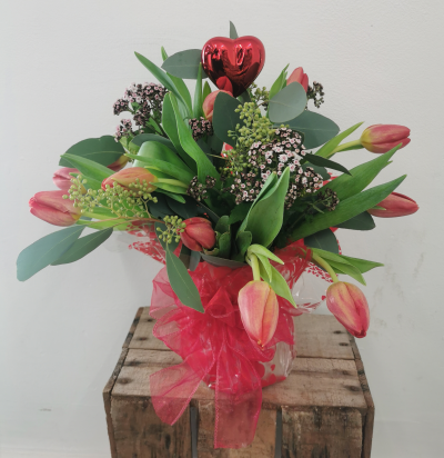 Tulip Love ❤️ Vase - A selection of red tulips and mix of foliage with a Love ❤️ in a gift wrapped vase